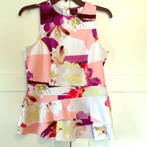 Fitted peplum sleeveless shirt